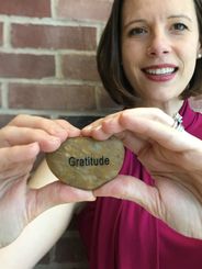 Erin holding gratitude stone